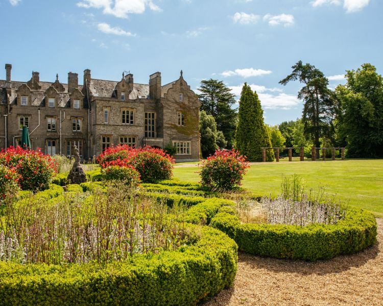 the exterior gardens of a country house hotel in hertfordshire