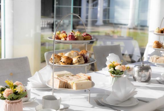 an afternoon tea laid out at a manor house hotel in hertfordshire