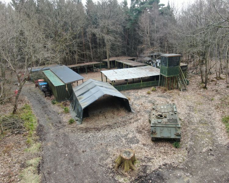 a view from above of a woodland paintball site