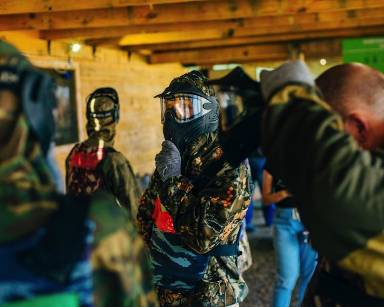 people getting geared up ready for a paintball experience