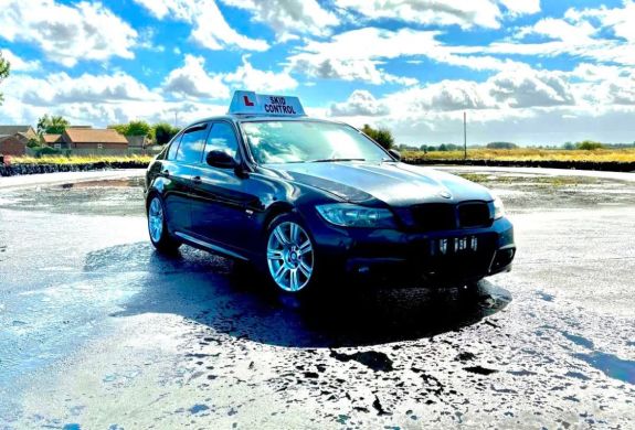 a car parked on a skid pan ready for a skid pan driving experience