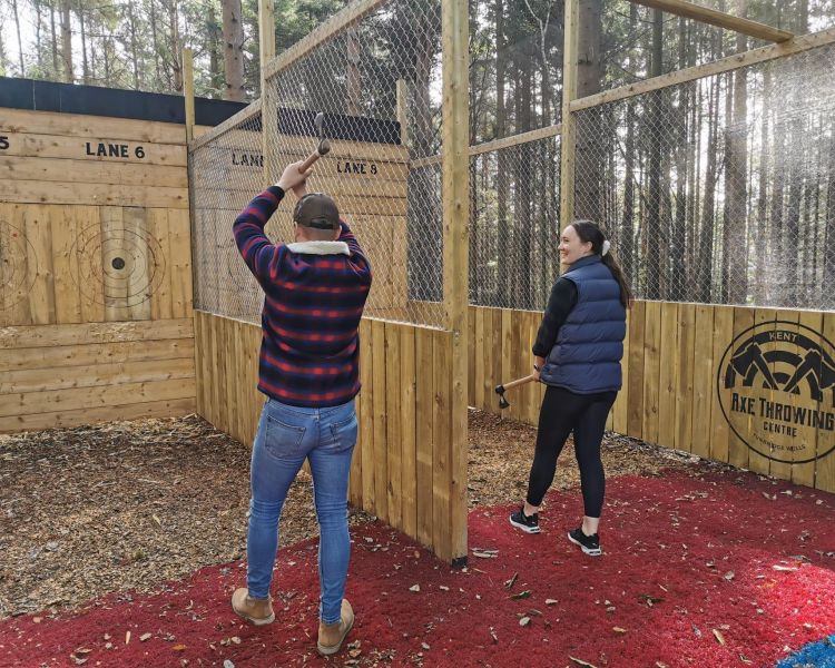 people throwing axes on an axe throwing experience in tunbridge wells in kent