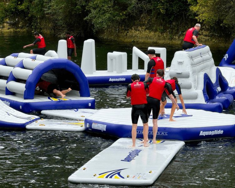 People playing on inflatable waterpark