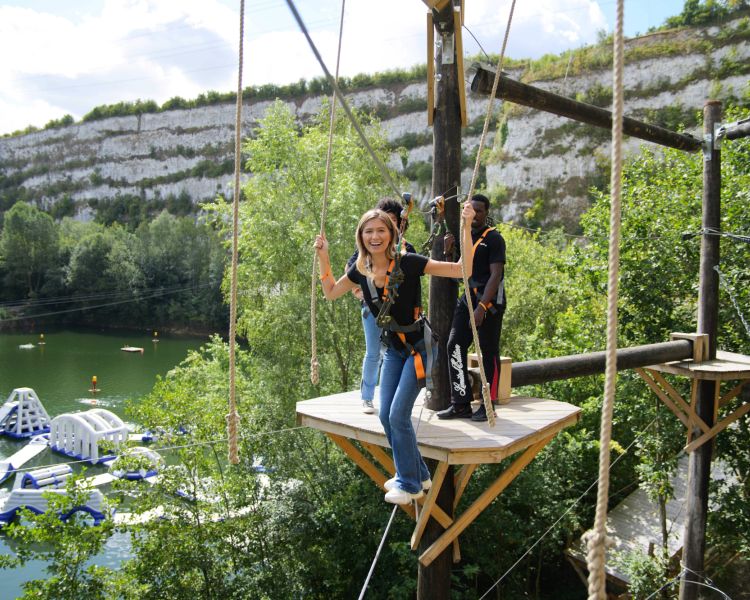 Woman on high ropes course