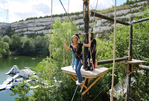 Woman on high ropes course