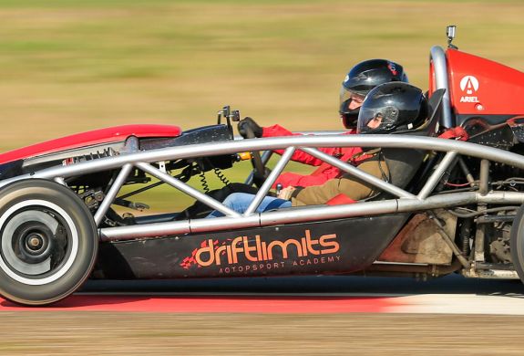 side view of a race car being driven on a race track