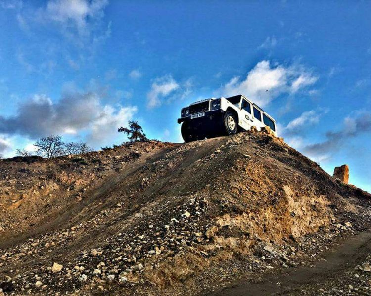 Young person taking part in a Land Rover off road driving experience