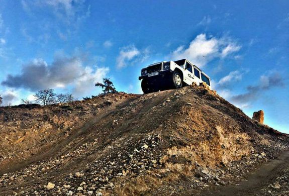 Young person taking part in a Land Rover off road driving experience