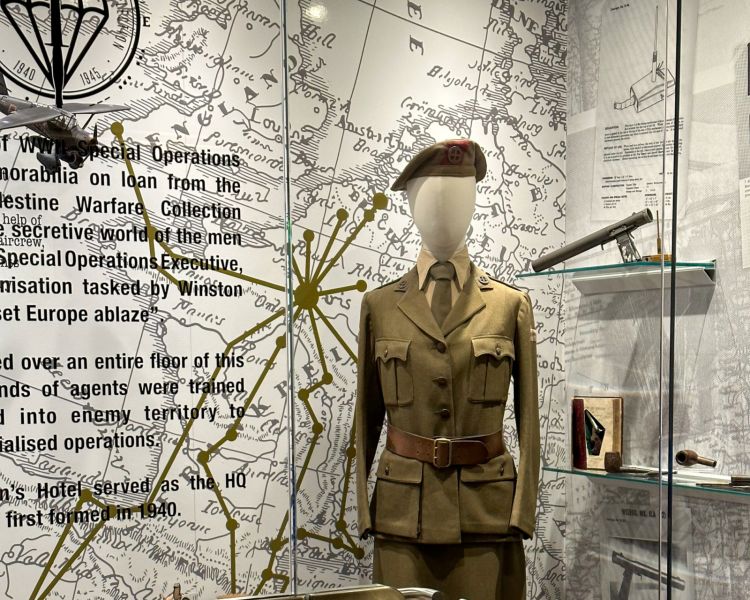 museum display showing special operations memorabilia such as uniform and accessories