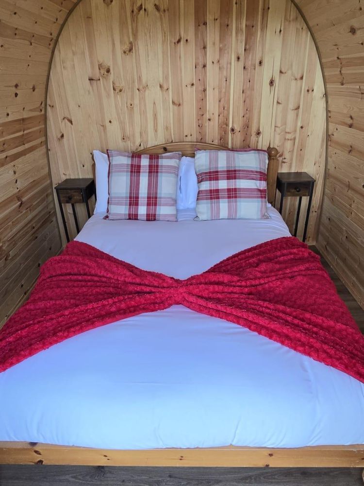 inside a glamping pod showing a double bed for a stonehenge unique stay