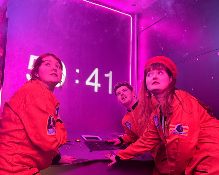 three people in an escape room in liverpool called supernova