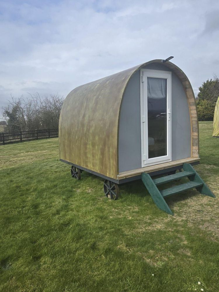the front of a glamping pod used for a stonehenge unique stay