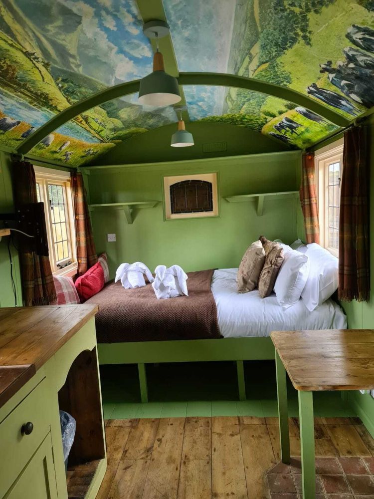 The bed area inside the shepherds hut used for short stays near stonehenge