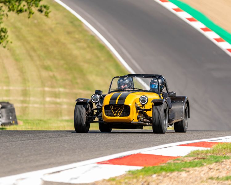 a caterham seven on the race track for a driving experience