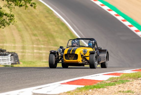a caterham seven on the race track for a driving experience