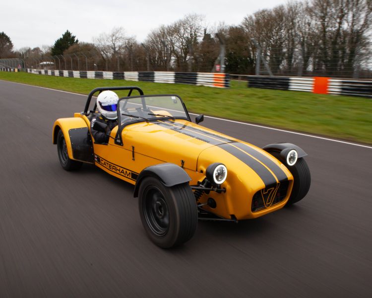 a caterham seven on the race track for a driving experience