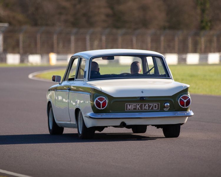 a classic car on a race track for a supercar vs classic car driving experience