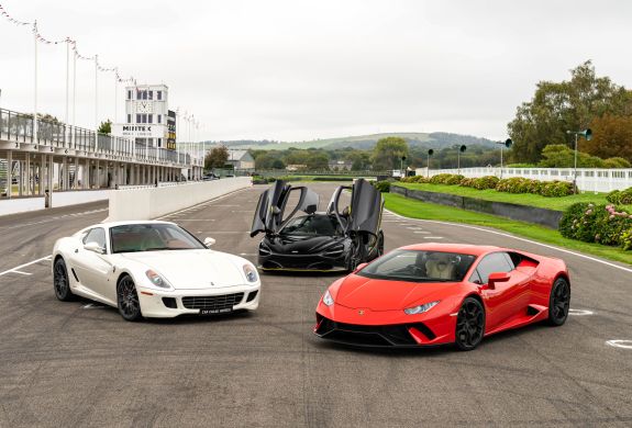 three supercars on a race track for a driving experience