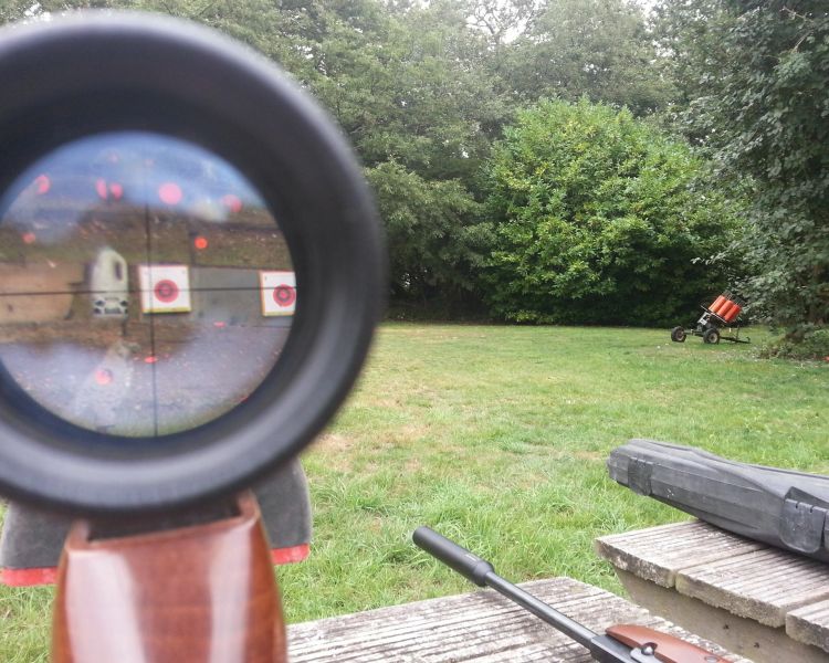looking at a target through the view finder of an air rifle as part of an air rifle shooting experience