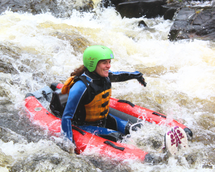 woman on a river bugging experience on the river tummel in scotland