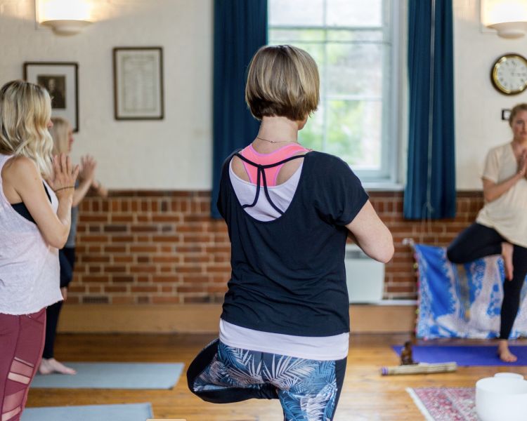 women at a yoga class on a mindfulness day retreat experience