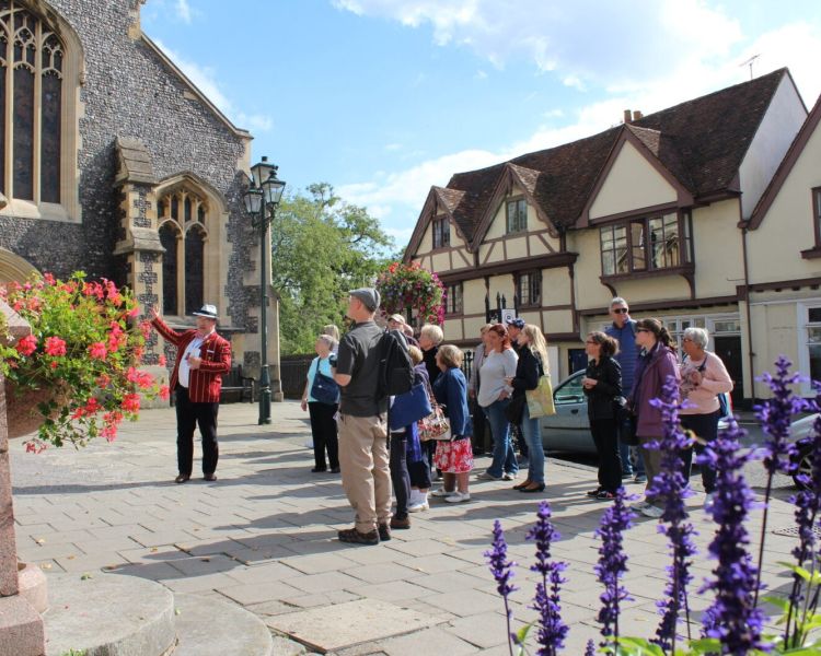 Guide talking to group in henley seen on a midsomer murders coach tour