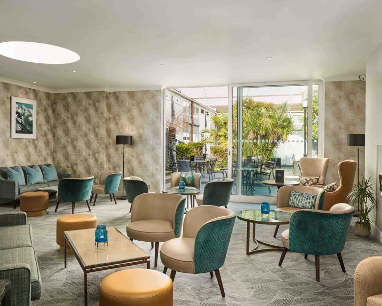 the conservatory area of a hotel on the hampshire coast