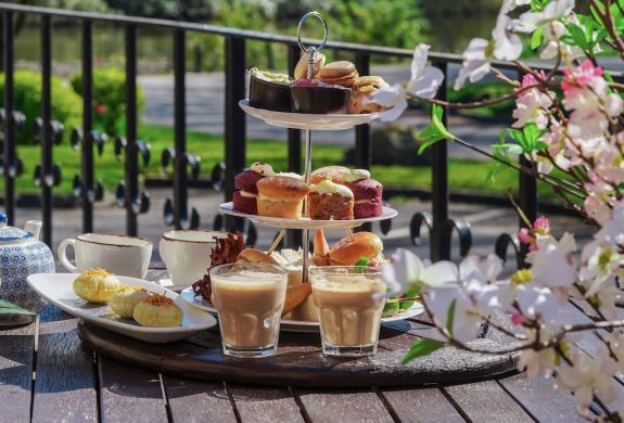 a mumbai afternoon tea set up on the terrace at a hotel in lancashire