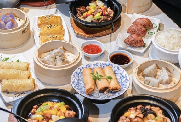table full of chinese dishes for a three course lunch menu at a chinese restaurant in london