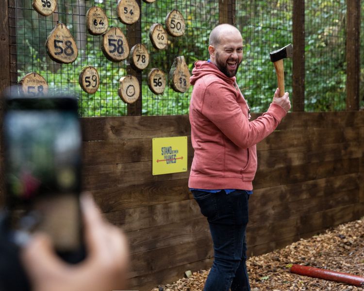 man about to throw an axe at go ape axe throwing experience