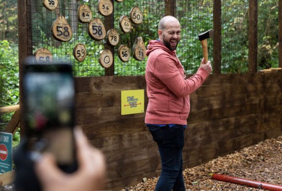 man about to throw an axe at go ape axe throwing experience