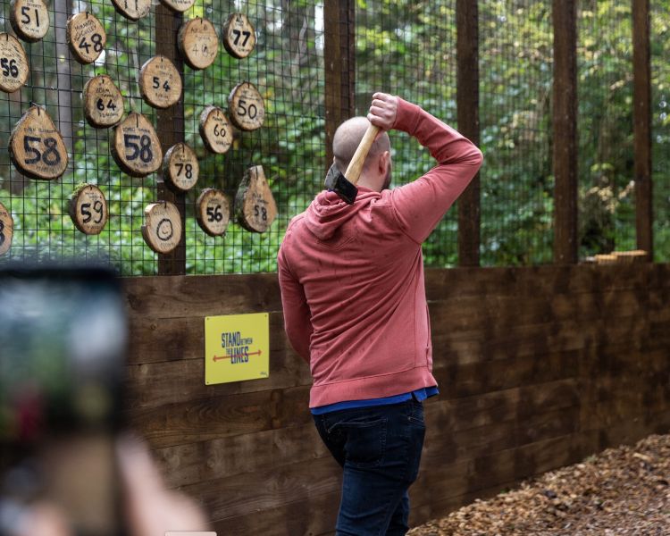 man about to throw axe at go ape axe throwing experience