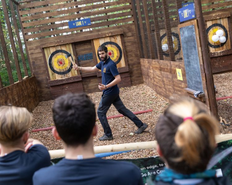 instructor explaining axe throwing at go ape