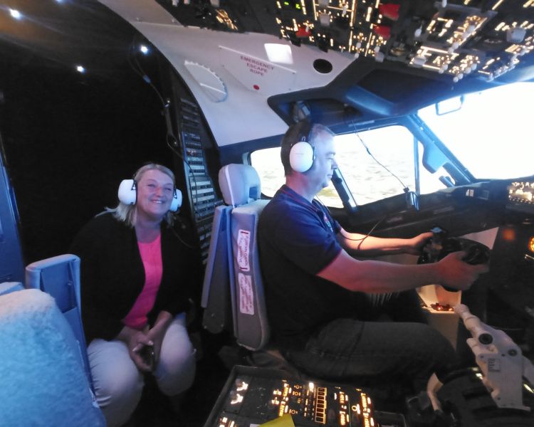 Man in boeing 737 flight simulator