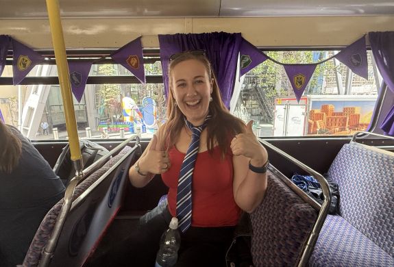 Woman smiling on the harry potter london bus tour