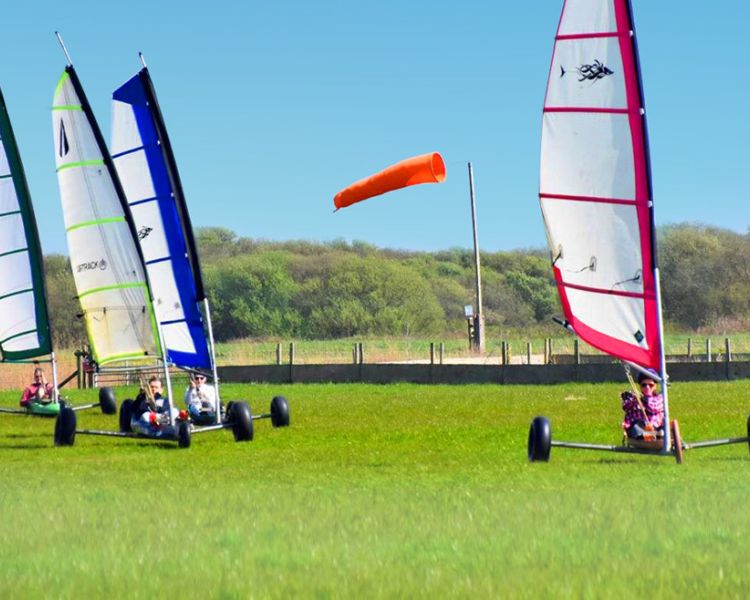four land yachts on grass for a land yachting for groups experience day