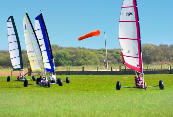 four land yachts on grass for a land yachting for groups experience day