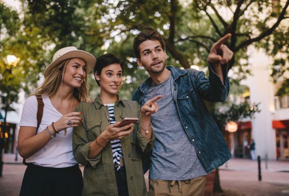 Friends playing game in city