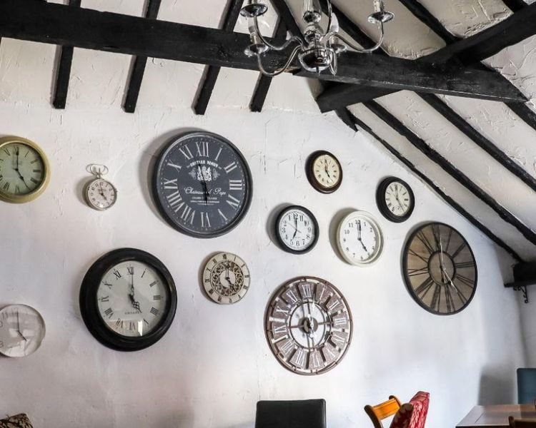 Tea room with wall full of clocks