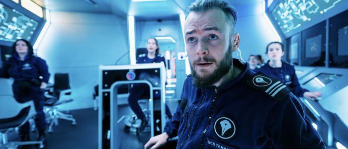 people on an immersive spaceship simulator experience in london
