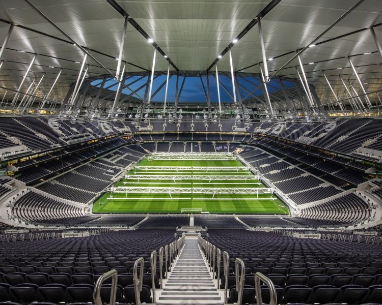 view of the pitch from the stands on the tottenham hotspur stadium tour in london