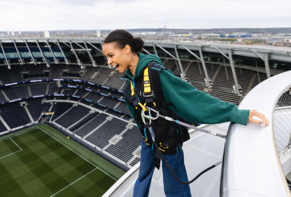 visitor looking out over the pitch on the tottenham hotspur skywalk experience in london