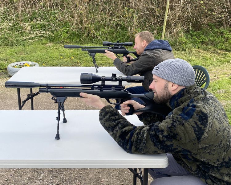 2 people on an air rifle shooting experience with rapid airgun training