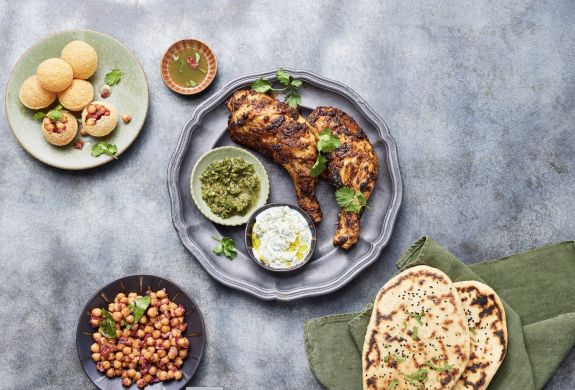 plates of indian street food made at jamie oliver cookery school in london