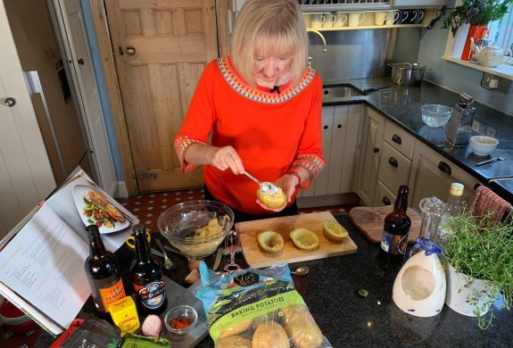 Nerys cooking at her home