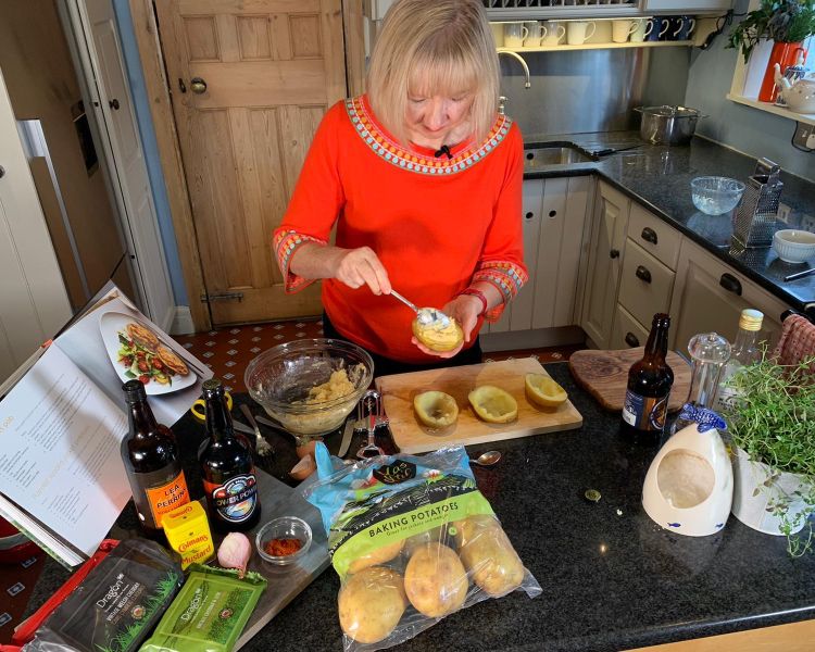 Nerys cooking at her home