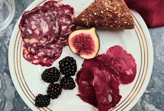 plate of charcuterie with fruit and bread made on a charcuterie making course with bray cured