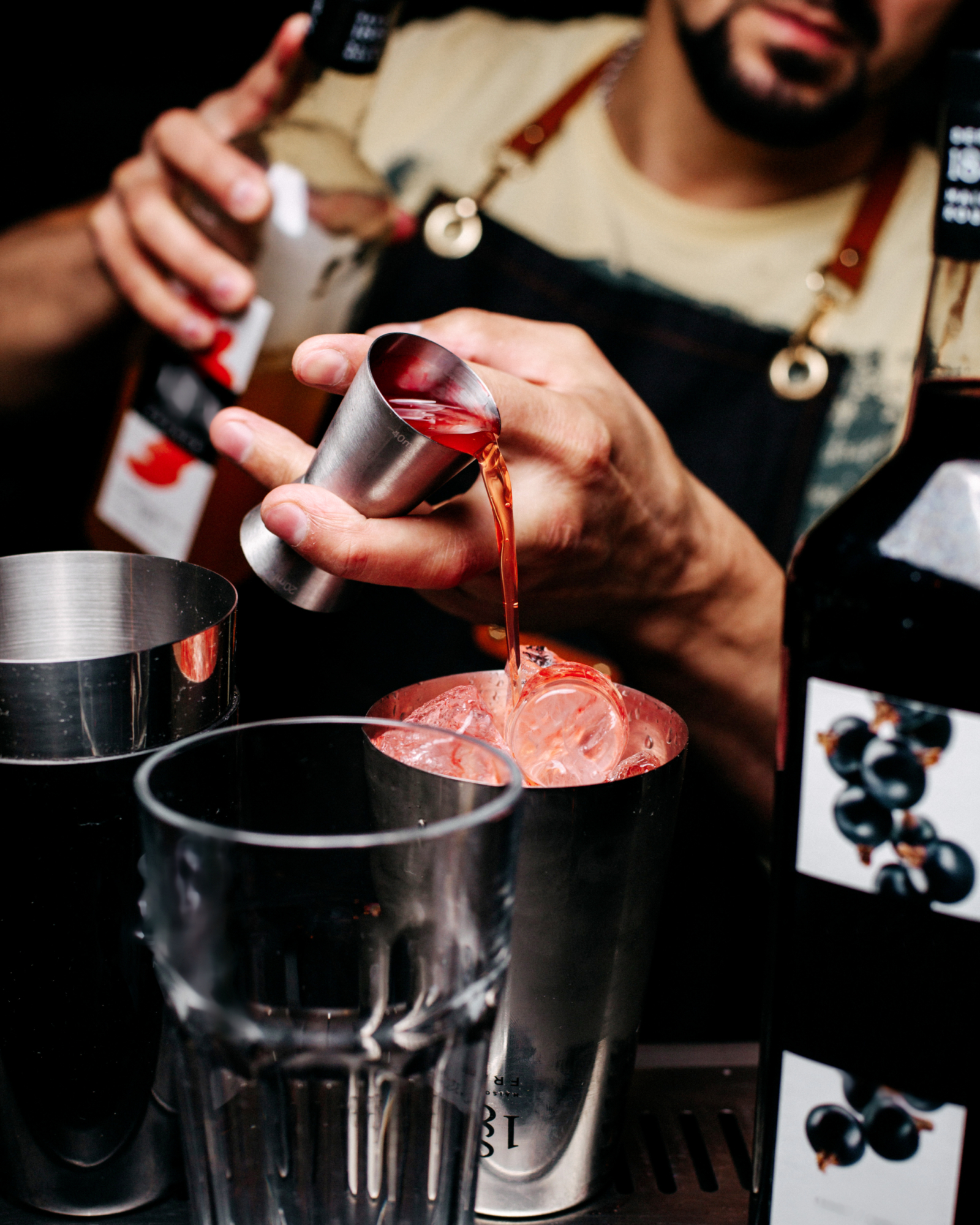 Front view bartender making drink