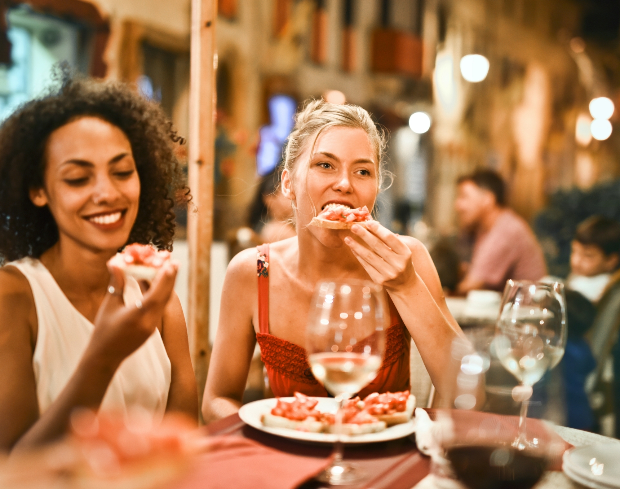 Women eating bruschetta