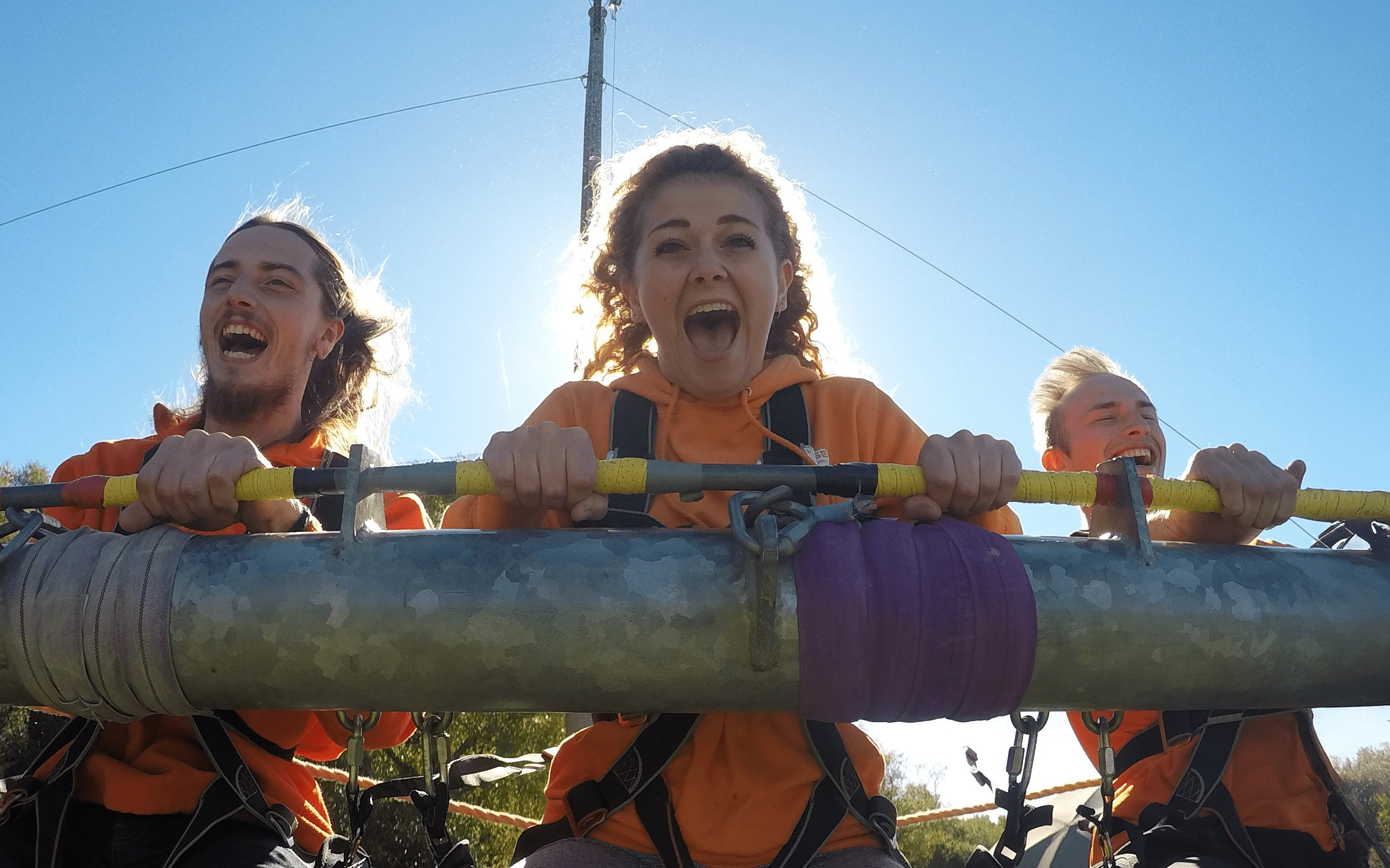 3 people on gravity swing